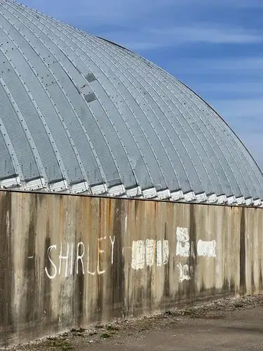Steel curves, concrete secrets, and a whispered name.